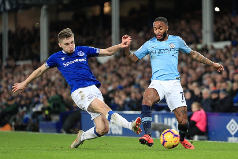 Raheem Sterling of Manchester City is tackled by Jonjoe Kenny of Everton during the Premier League match between Everton FC and Manchester City at Goodison Park on February 06, 2019 in Liverpool, United Kingdom. PHOTO/GettyImages