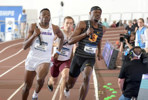 Rai Benjamin of Southern California and Grant Holloway of Florida run the second leg of the 4 x 400m relay during the NCAA Indoor Track and Field Championships at the McFerrin Athletic Center. USC won in a world record 3:00.77. PHOTO | AFP