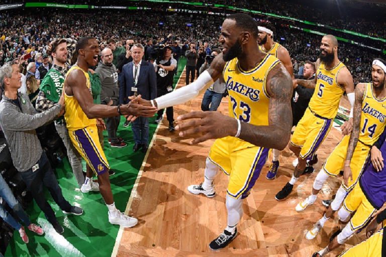 Rajon Rondo #9 and LeBron James #23 of the Los Angeles Lakers celebrate after the game against the Boston Celtics on February 7, 2019 at the TD Garden in Boston, Massachusetts. PHOTO/GettyImages