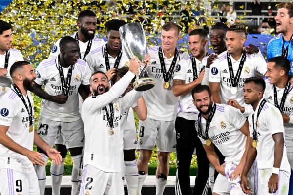 Real Madrid players including Real Madrid's Spanish defender Dani Carvajal (C) celebrate with the trophy after the UEFA Super Cup football match between Real Madrid vs Eintracht Frankfurt in Helsinki, on August 10, 2022. Real Madrid won the match 2-0. PHOTO | AFP