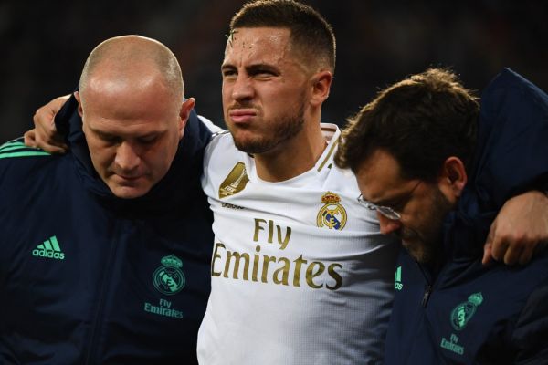 Real Madrid's Belgian forward Eden Hazard gestures in pain during the UEFA Champions League group A football match Real Madrid against Paris Saint-Germain FC at the Santiago Bernabeu stadium in Madrid on November 26, 2019. PHOTO | AFP
