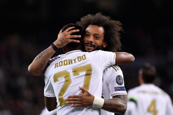 Real Madrid's Brazilian forward Rodrygo (L) celebrates with Real Madrid's Brazilian defender Marcelo after scoring during the UEFA Champions League Group A football match between Real Madrid and Galatasaray at the Santiago Bernabeu stadium in Madrid, on November 6, 2019. PHOTO | AFP