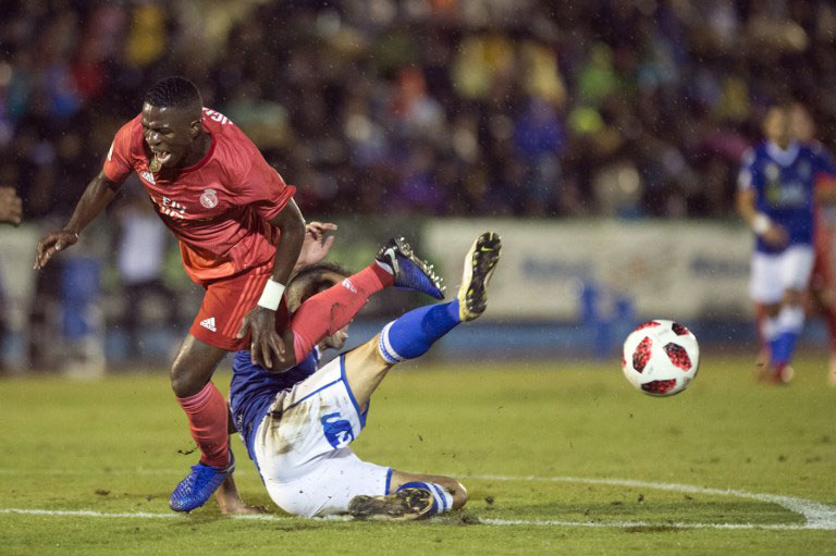 Real Madrid's Brazilian forward Vinicius Junior (L) vies with UD Melilla's Spanish defender Ricardo Segura “Richi” during the Spanish King's Cup (Copa del Rey) football match between UD Melilla and Real Madrid CF at the Alvarez Claro municipal stadium in the autonomous city of Melilla on October 31, 2018. PHOTO/AFP