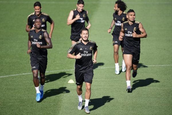 Real Madrid's Brazilian forward Vinicius Junior, Real Madrid's Belgian forward Eden Hazard, Real Madrid's Brazilian midfielder Casemiro (BACK L to R) Real Madrid's French defender Raphael Varane, Real Madrid's Colombian midfielder James Rodriguez and Real Madrid's Brazilian defender Marcelo take part in a training session at Real Madrid's sport city in Madrid on August 16, 2019. PHOTO | AFP