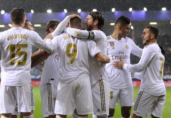 Real Madrid's French forward Karim Benzema (C) celebrates with teammates after scoring a goal during the Spanish league football match between SD Eibar and Real Madrid CF at the Ipurua stadium in Eibar on November 9, 2019.  PHOTO | AFP