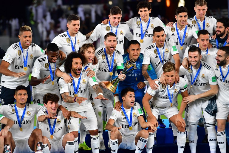 Real Madrid's players celebrate with the trophy after winning the FIFA Club World Cup final football match Spain's Real Madrid vs Abu Dhabi's Al Ain at the Zayed Sports City Stadium in Abu Dhabi, the capital of the United Arab Emirates, on December 22, 2018. PHOTO/AFP