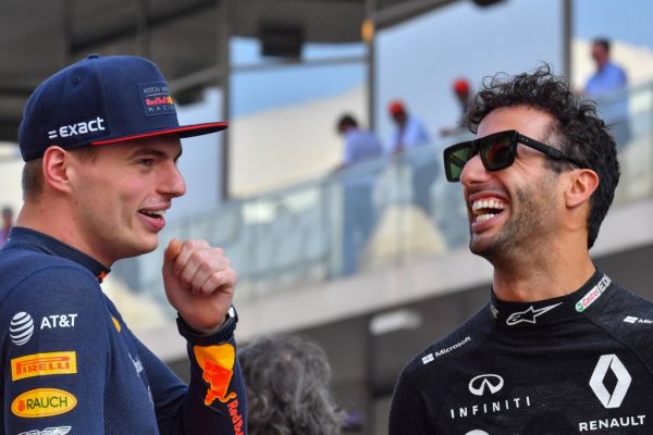 Red Bull Racing's Dutch driver Max Verstappen (L) and Renault's Australian driver Daniel Ricciardo chat during the drivers parade at the Yas Marina Circuit in Abu Dhabi, ahead of the final race of the Formula One Grand Prix season, on December 1, 2019. PHOTO | AFP