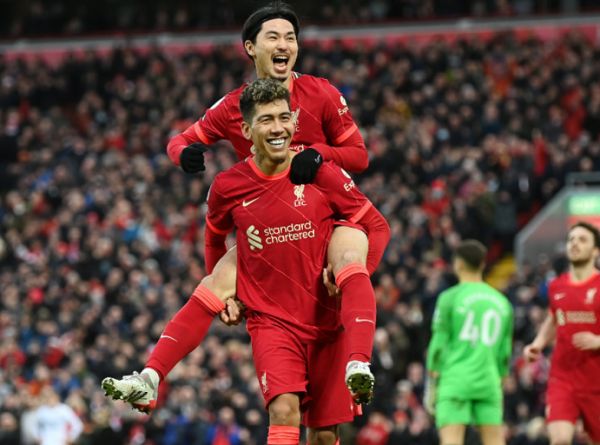 Roberto Firmino and Takumi Minamino celebrate in a 3-0 victory against Brentford on Sunday, January 16, 2022 at Anfield. PHOTO | Twitter