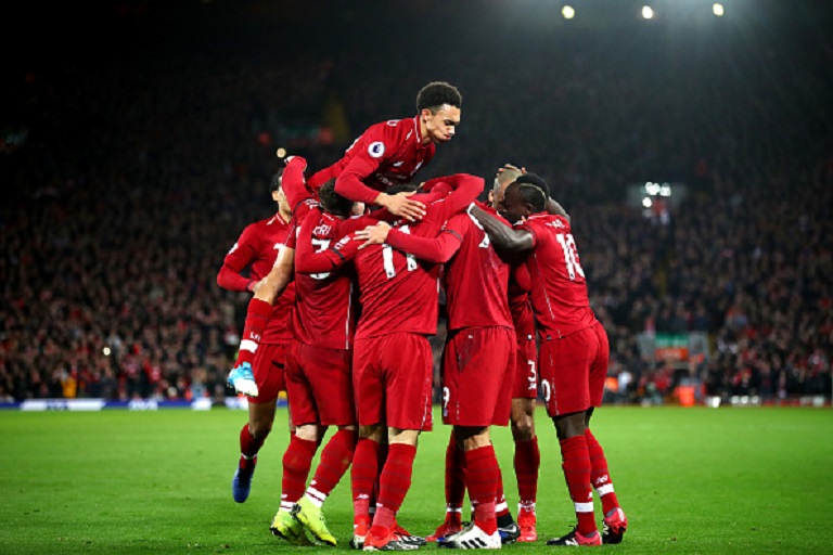 Roberto Firmino of Liverpool celebrates with team mates after scoring his sides second goal during the Premier League match between Liverpool FC and Arsenal FC at Anfield on December 29, 2018 in Liverpool, United Kingdom.PHOTO:GETTY IMAGES