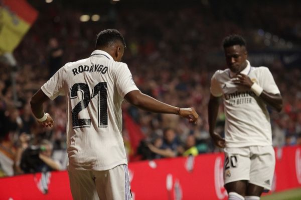 Rodrygo (L) of Real Madrid celebrates with his teammates after scoring a goal during the Spanish La Liga week 6th soccer match between at the Spotify Camp Nou Stadium on September 18, 2022 in Madrid, Spain. PHOTO | AFP