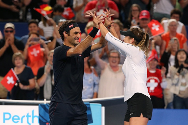 Roger Federer and Belinda Bencic of Switzerland celebrate winning the Hopman Cup final against Alexander Zverev and Angelique Kerber of Germany on day eight of the 2019 Hopman Cup at RAC Arena on January 05, 2019 in Perth, Australia. PHOTO/GettyImages