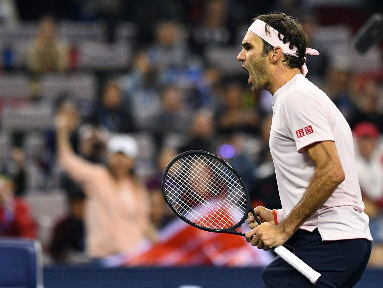 Roger Federer of Switzerland reacts after winning against Kei Nishikori of Japan during their men's singles quarter-final match at the Shanghai Masters tennis tournament on October 12, 2018. PHOTO/AFP