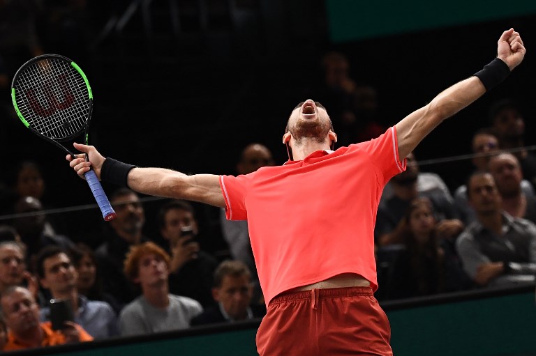 Russia's Karen Khachanov celebrates after winning against Serbia's Novak Djokovic at the end of their men's singles final tennis match on day seven of the ATP World Tour Masters 1000 - Rolex Paris Masters - indoor tennis tournament at The AccorHotels Arena in Paris, on November 4, 2018.PHOTO / AFP