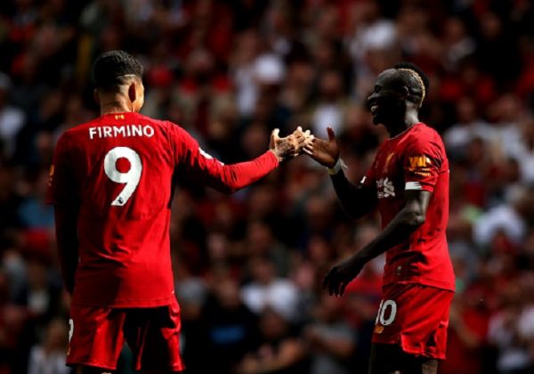 Sadio Mane of Liverpool celebrates with Roberto Firmino after he scores his team's second goal during the Premier League match between Liverpool FC and Newcastle United at Anfield on September 14, 2019 in Liverpool, United Kingdom. PHOTO/ GETTY IMAGES
