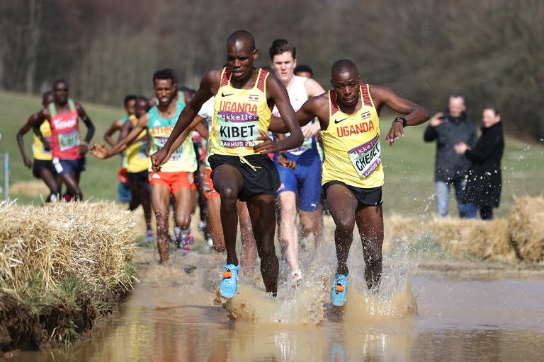 Samuel Kibet of Uganda leads the field past the water barrier during the Under 20 race of the Aarhus 2019 IAAF World Cross Country Championships on Saturday, March 30, 2019. PHOTO/IAAF