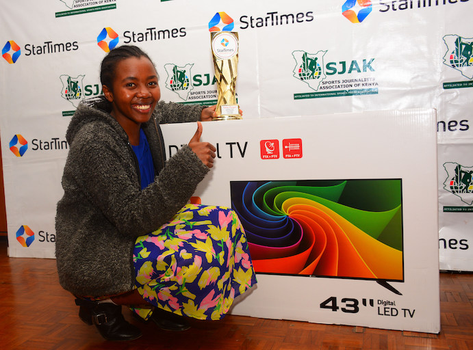 Sasha Mwongeli poses with her trophy and smart television following the presentation of the StarTimes/SJAK Sports Personality of the Month for October on Thursday, October 5, 2018. PHOTO/Courtesy