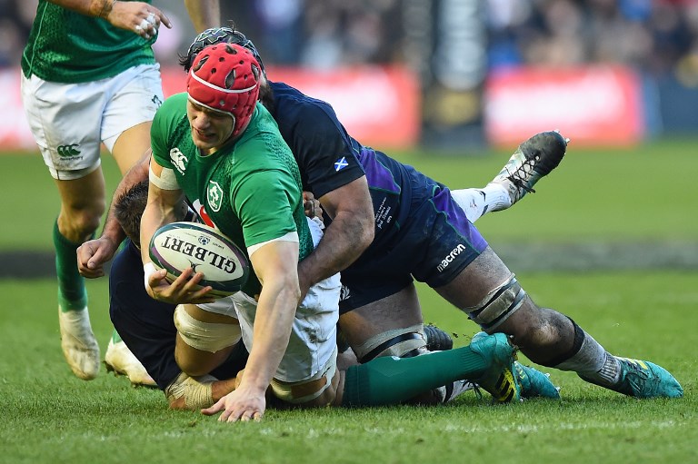 Scotland's number 8 Josh Strauss (R) tackles Ireland's flanker Josh Van Der Flier during the Six Nations international rugby union match between Scotland and Ireland at Murrayfield in Edinburgh, Scotland on Febuary 9, 2019. PHOTO/AFP