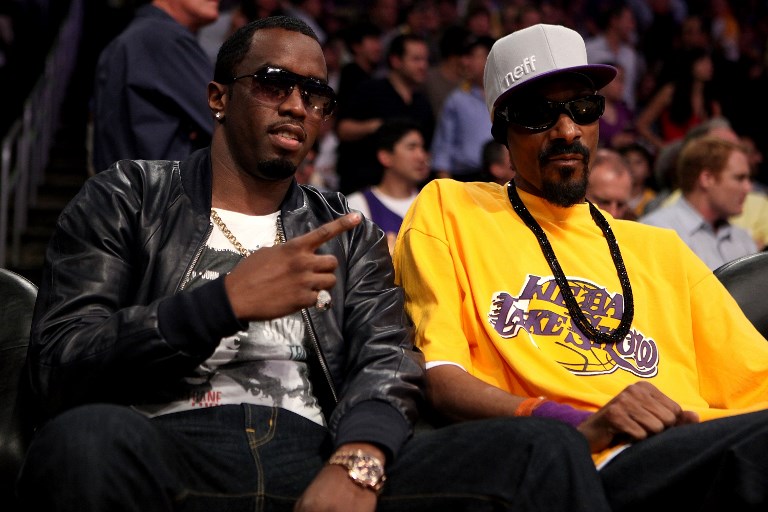 Sean Combs (L) and Snoop Dogg attend Game Six of the NBA playoff finals between the Boston Celtics and the Los Angeles Lakers during the 2010 NBA Playoff on June 15, 2010 in Los Angeles, California. PHOTO/AFP