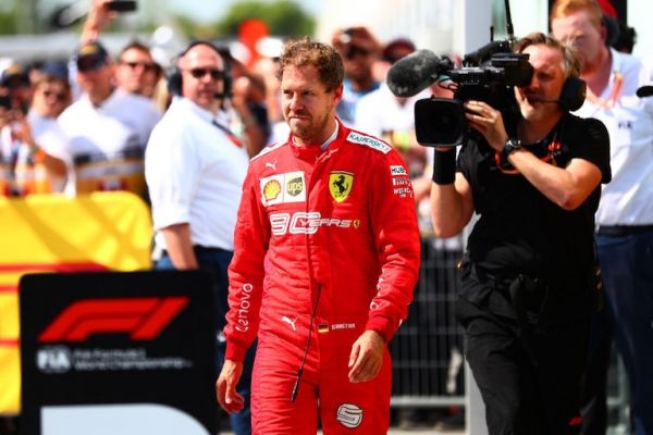 Sebastian Vettel of Germany and Ferrari walks in to parc ferme to swap the 1st and 2nd place boards after the F1 Grand Prix of Canada at Circuit Gilles Villeneuve on June 9, 2019 in Montreal, Canada. PHOTO/AFP