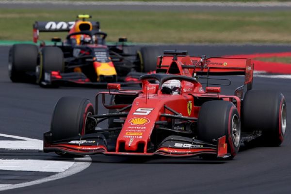 Sebastian Vettel of Germany driving the (5) Scuderia Ferrari SF90 leads Pierre Gasly of France driving the (10) Aston Martin Red Bull Racing RB15 on track during the F1 Grand Prix of Great Britain at Silverstone on July 14, 2019 in Northampton, England.PHOTO/ GETTY IMAGES