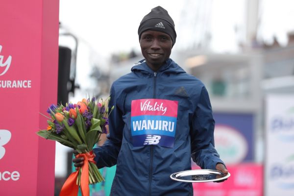 Second placed Kenya's Daniel Wanjiru poses with his trophy after the half marathon elite men's race during the inaugural The Big Half in London on March 4, 2018. PHOTO | AFP