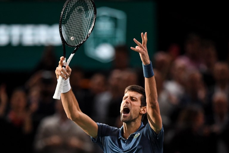 Serbia's Novak Djokovic celebrates after winning against Switzerland's Roger Federer at the end of their men's singles semi-final tennis match on day six of the ATP World Tour Masters 1000 - Rolex Paris Masters - indoor tennis tournament at The AccorHotels Arena in Paris, on November 3, 2018. PHOTO/AFP