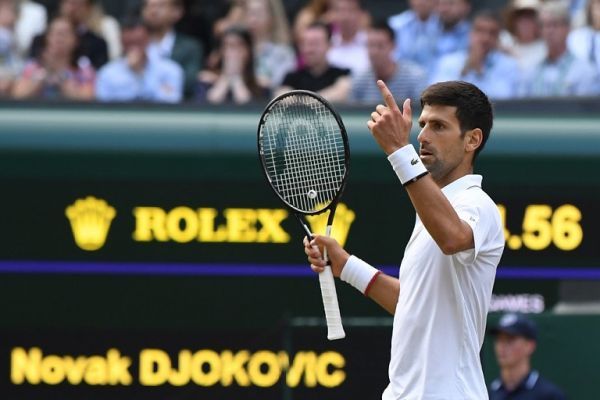Serbia's Novak Djokovic challenges a call in the fifth set tie breaker against Switzerland's Roger Federer during the men's singles final on day thirteen of the 2019 Wimbledon Championships at The All England Lawn Tennis Club in Wimbledon, southwest London, on July 14, 2019. PHOTO | AFP