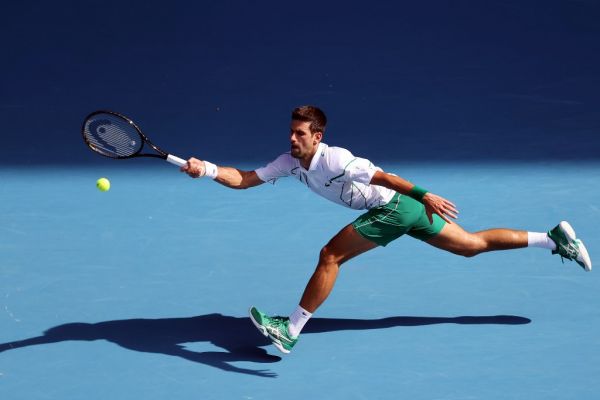 Serbia's Novak Djokovic hits a return against Argentina's Diego Schwartzman during their men's singles match on day seven of the Australian Open tennis tournament in Melbourne on January 26, 2020. PHOTO | AFP
