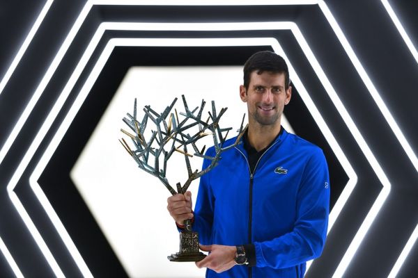 Serbia's Novak Djokovic poses with his trophy after winning against by Canada's Denis Shapovalov during their men's singles final tennis match at the ATP World Tour Masters 1000 - Rolex Paris Masters - indoor tennis tournament at The AccorHotels Arena in Paris on November 3, 2019. PHOTO | AFP