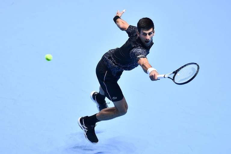 Serbia's Novak Djokovic returns against Germany's Alexander Zverev during their mens singles round-robin match on day four of the ATP World Tour Finals tennis tournament at the O2 Arena in London on November 14, 2018. PHOTO/AFP