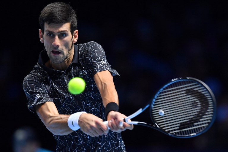 Serbia's Novak Djokovic returns against South Africa's Kevin Anderson during their men's singles semi-final match on day seven of the ATP World Tour Finals tennis tournament at the O2 Arena in London on November 17, 2018. PHOTO/AFP