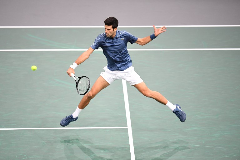 Serbia's Novak Djokovic returns the ball to Bosnia-Herzegovina's Damir Dzumhur during their men's singles third round tennis match on day four of the ATP World Tour Masters 1000 - Rolex Paris Masters - indoor tennis tournament at The AccorHotels Arena in Paris, on November 1, 2018.PHOTO/AFP