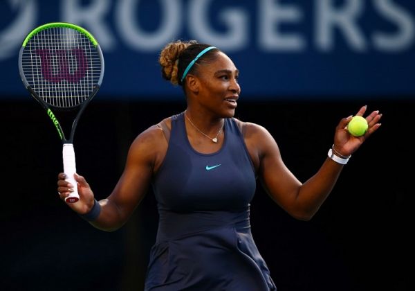 Serena Williams of the United States reacts to a gust of wind on the court during a quarterfinal match against Naomi Osaka of Japan on Day 7 of the Rogers Cup at Aviva Centre on August 09, 2019 in Toronto, Canada. PHOTO | AFP