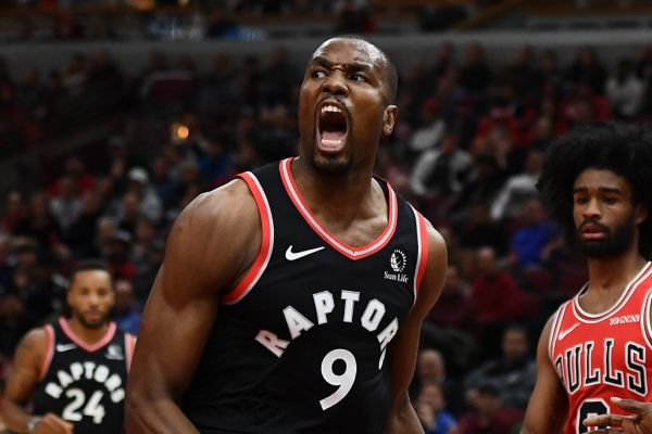 Serge Ibaka #9 of the Toronto Raptors celebrates a dunk against the Chicago Bulls during the first quarter at United Center on October 26, 2019 in Chicago, Illinois. PHOTO | AFP