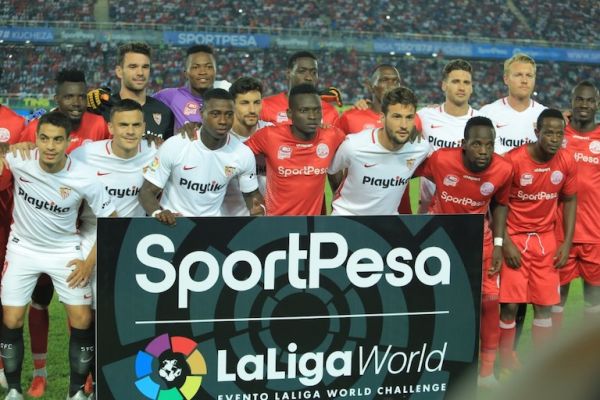 Sevilla FC (in white) and Simba SC players pose ahead of their SportPesa Challenge, La Liga World clash at the National Main Stadium, Dar-es-Salaam on May 23, 2019. PHOTO/SPN