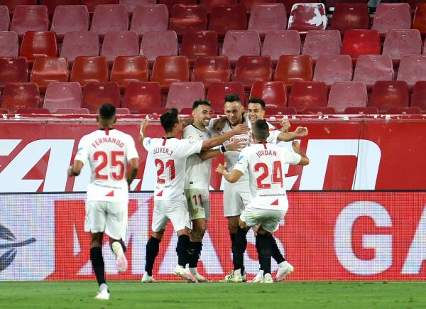 Sevilla's Argentinian midfielder Lucas Ocampos (3R) celebrates after scoring a goal during the Spanish league football match between Sevilla FC and RCD Mallorca at the Ramon Sanchez Pizjuan stadium in Seville on July 12, 2020. PHOTO | AFP