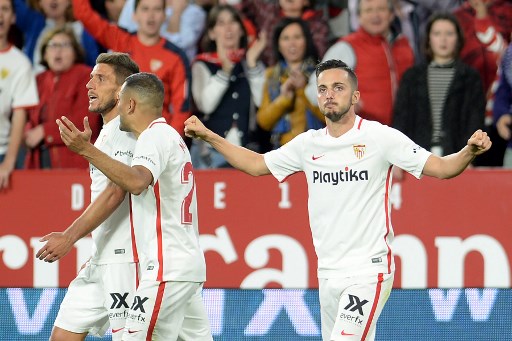 Sevilla's Spanish midfielder Pablo Sarabia (R) celebrates with teammates after scoring a goal during the Spanish league football match between Sevilla FC and Real Betis at the Ramon Sanchez Pizjuan stadium in Sevilla on April 13, 2019. PHOTO/AFP