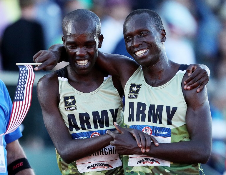 Shadrack Kipchirchir (left), second place and Leonard Korir, third place, react after the Men's 10000 Meter Final during the 2016 U.S. Olympic Track & Field Team Trials at Hayward Field on July 1, 2016 in Eugene, Oregon. PHOTO/AFP