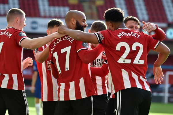 Sheffield United's English-born Irish striker David McGoldrick (C) celebrates with teammates after scoring his second goal during the English Premier League football match between Sheffield United and Chelsea at Bramall Lane in Sheffield, northern England on July 11, 2020. PHOTO | AFP