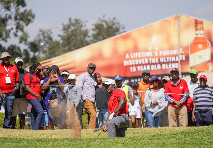 Simon Ngige hits fourth shot off the 18th green bunker on round three of the 2019 Magical Kenya Open Golf Championship on Saturday, March 19, 2019. PHOTO/Courtesy