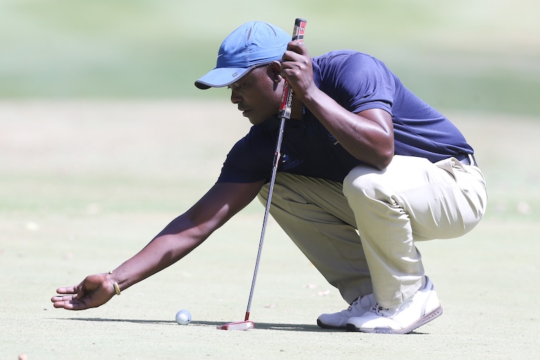 Simon Ngige lines up a putt at the Karen Country Club on Round One of the 2019 Magical Kenya Open Golf Championship on Thursday, March 14, 2019. PHOTO/Courtesy/Organisers