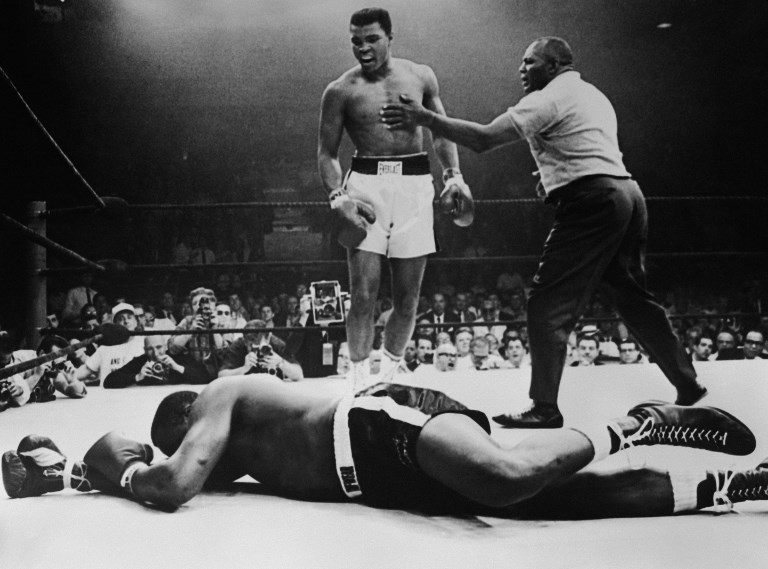 Sonny Liston lies out for the count after being KO'd in the first round of his return title fight by world heavyweight champion Muhammad Ali, Lewiston, Maine, May 25, 1965. PHOTO/AFP