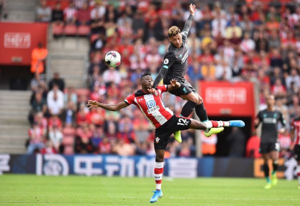 Southampton's Malian midfielder Moussa Djenepo (L) vies with Liverpool's English midfielder Alex Oxlade-Chamberlain (R) during the English Premier League football match between Southampton and Liverpool at St Mary's Stadium in Southampton, southern England on August 17, 2019. PHOTO | AFP