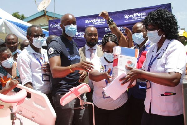 SportPesa CEO Cpatain Ronald Karauri poses with equipment donated to Njiru hospital on Wednesday, February 9, 2022. PHOTO | SPN