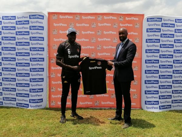 SportPesa Chief Executive Officer, Captain Ronald Karauri (left) poses with a Murang'a Seal jersey alongside Team Manager John Wanjie at the St. Sebastien Park in Murang'a on Friday, October 1, 2021. PHOTO |Courtesy