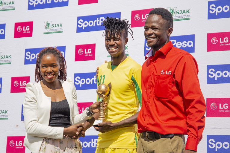 SportPesa Digital Executive Triza Akoth (left) presents the award to Kakamega Homeboyz FC midfielder Peter Thiong'o after he was named the December SPL Player of the Month on Wednesday, February 6 at the Bukhungu Stadium in Kakamega. PHOTO/SPN