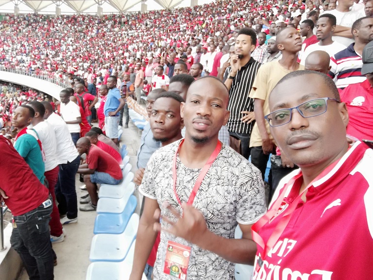SportPesa News Senior Content Editor Mutwiri Mutuota (right) samples the bubbly atmosphere at the National Stadium, Dar-es-Salaam during the CAF Champions League clash between Simba SC and JSS on Saturday, January 12, 2019. PHOTO/SPN