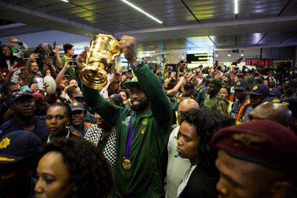 Springbok captain, Siya Kolisi, holding the World Rugby Cup after his arrival at O.R. Tambo International Airport in Johannesburg, South Africa on November 5, 2019 South Africa's World Cup winning rugby squad arrived home on Tuesday to a heroes' welcome and will be embarking on a nation wide Champions Tour. PHOTO | AFP