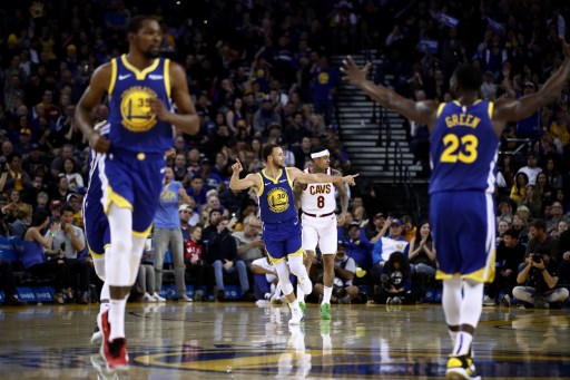 Stephen Curry (30) of the Golden State Warriors reacts after making a basket against the Cleveland Cavaliers at ORACLE Arena on April 05, 2019 in Oakland, California. PHOTO/AFP