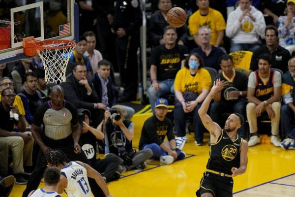 Stephen Curry #30 of the Golden State Warriors shoots the ball against the Dallas Mavericks during the third quarter in Game One of the 2022 NBA Playoffs Western Conference Finals at Chase Center on May 18, 2022 in San Francisco, California. PHOTO | AFP